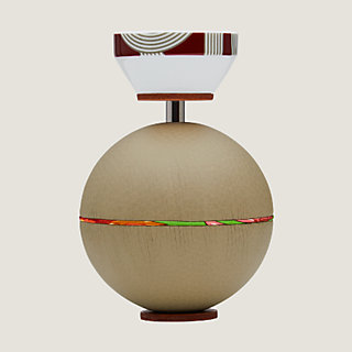 Spherical music box with a porcelain key | Hermès USA